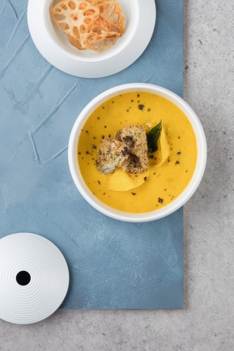 Kabocha squash soup with Bacalhao fish maw and black truffle